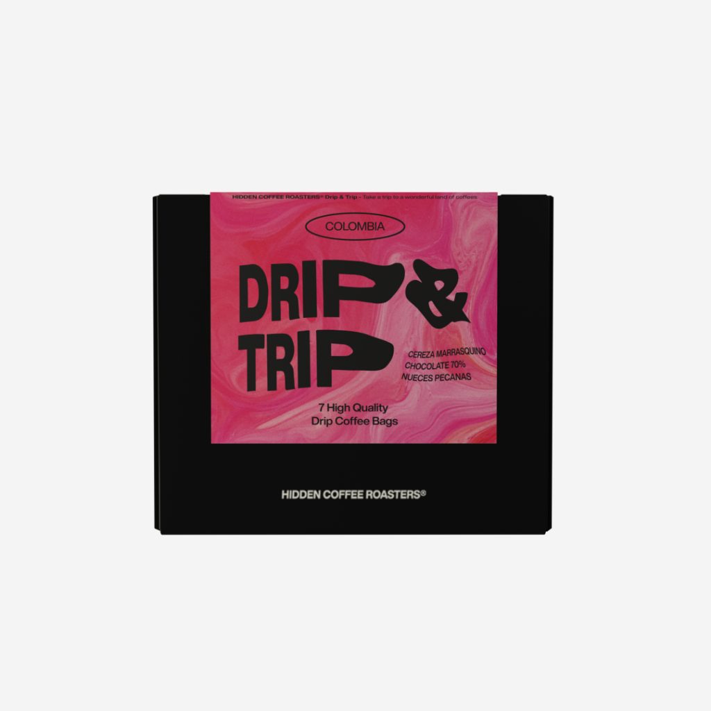 Caja negra de Hidden Coffee Roasters con etiqueta rosa "Drip & Trip" de Colombia, pack de 7 bolsitas de café filtro drip.